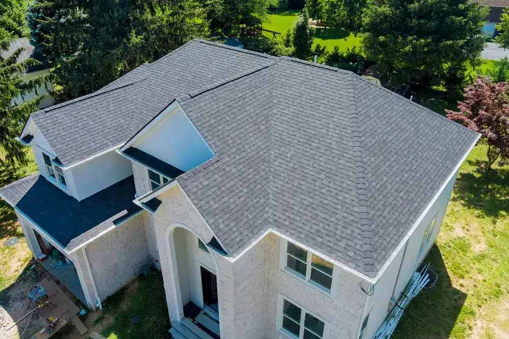 Aerial image of a home repaired its roof from storm damage in Central Iowa.